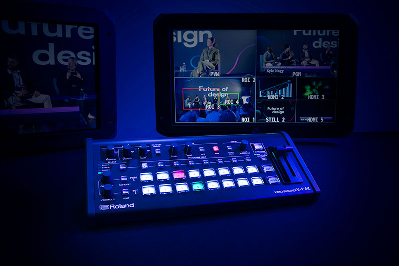 Technician with Roland's VC-1SC-4K Converter and V-1-4K Switcher